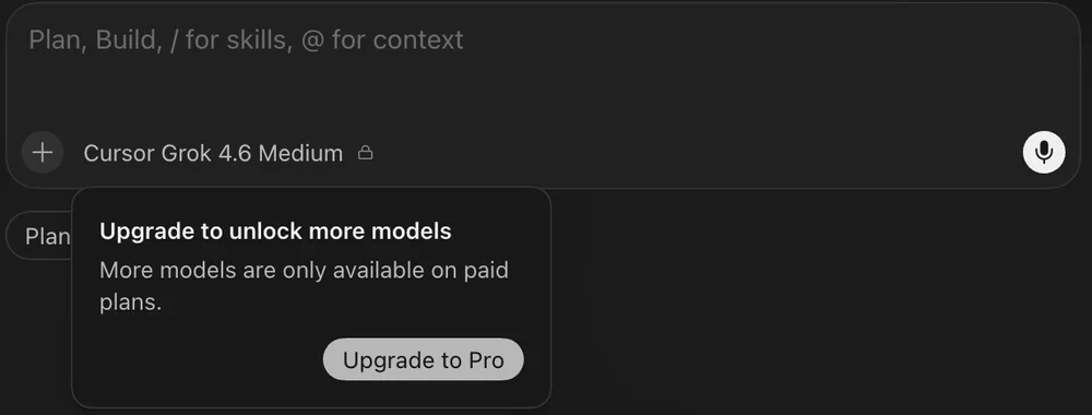 The model name under the Cursor prompt box with a lock icon, and a popover reading Upgrade to unlock more models, More models are only available on paid plans, with an Upgrade to Pro button